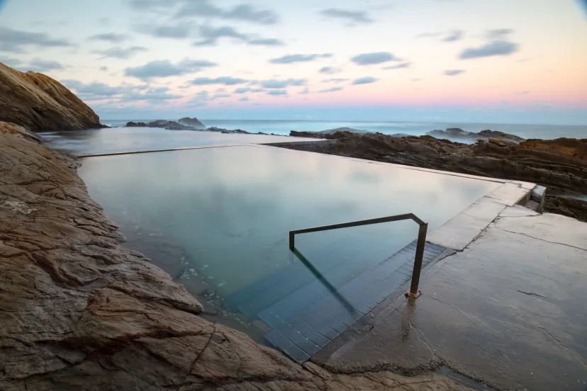 The Blue Pool, an ocean rock pool below the headland, at dawn