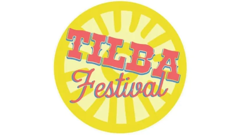 The Tilba Festival logo, retro lettering on a yellow sunburst
